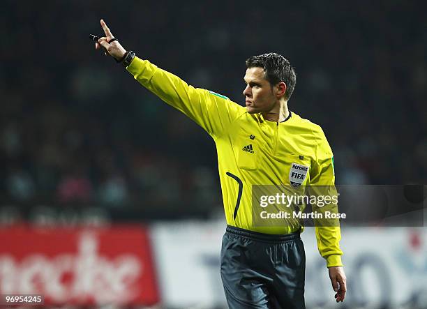 Referee Michael Weiner makes a point during the Bundesliga match between Werder Bremen and Bayer Leverkusen at the Weser Stadium on February 21, 2010...