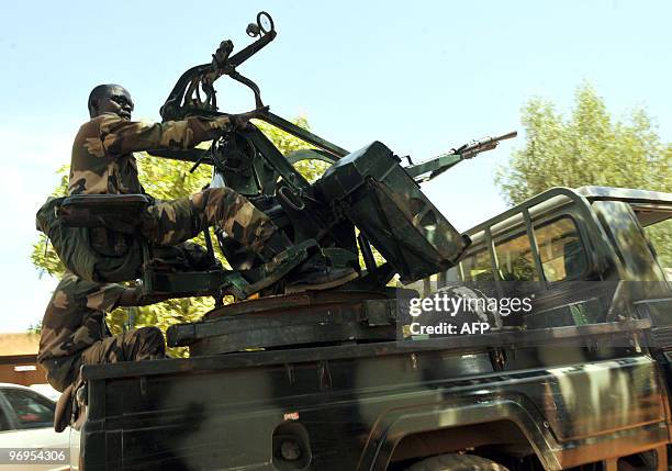 Niger's soldiers arrive on February 22, 2010 at a military compound in Niamey where is located the office of Salou Djibo, leader of the coup that...