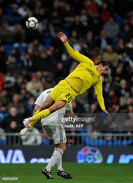 Real Madrid's Alvaro Arbeloa vies for the ball with villareal's Marco Ruben during their Spanish league football match at the Santiago Bernabeu...