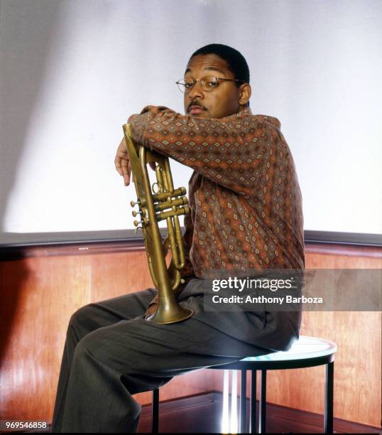 Portrait of American Jazz musician and composer Wynton Marsalis as he poses with his trumpet, 1992.