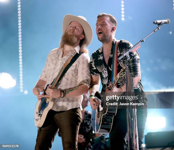 John Osborne and T.J. Osborne of musical duo Brothers Osborne perform onstage during the 2018 CMA Music festival at the Nissan Stadium on June 7,...