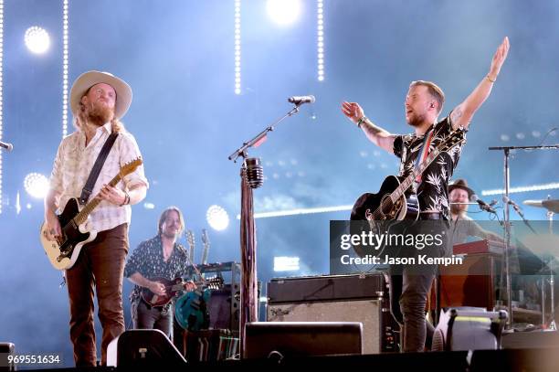 John Osborne and T.J. Osborne of musical duo Brothers Osborne perform onstage during the 2018 CMA Music festival at the Nissan Stadium on June 7,...