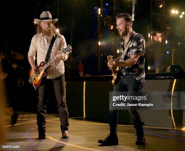 John Osborne and T.J. Osborne of musical duo Brothers Osborne perform onstage during the 2018 CMA Music festival at the Nissan Stadium on June 7,...