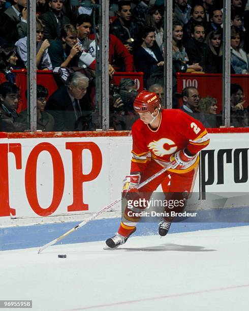 Al MacInnis of the Calgary Flames skates with the puck against the Montreal Canadiens in the late 1980's at the Montreal Forum in Montreal, Quebec,...