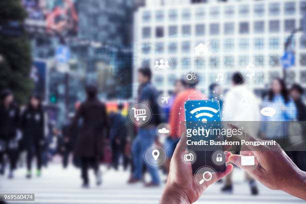 touching social icon on screen connect internet and network all device technology with city background of business in blue tone, business and technology concept - big tech stock pictures, royalty-free photos & images