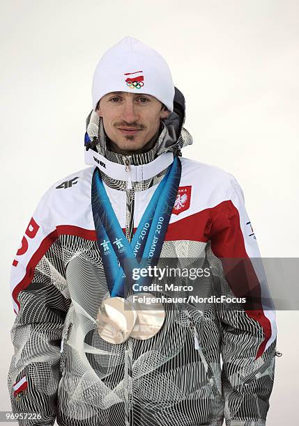 Adam Malysz of Poland presents his silver medals of the normal hill and large hill competions at the Olympic Winter Games Vancouver 2010 biathlon on...
