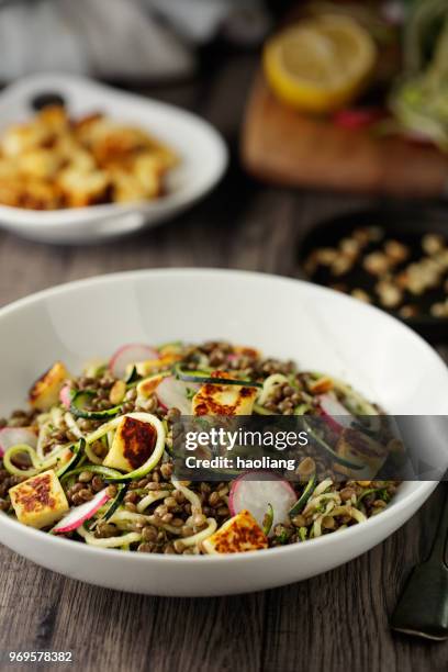 healthy lentil and courgette noodles salad with grilled halloumi cheese cubes - grilled halloumi stock pictures, royalty-free photos & images