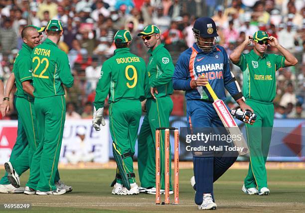 South African players stand after the dismissal of India's Virender Sehwag during the one day international cricket match between India and South...