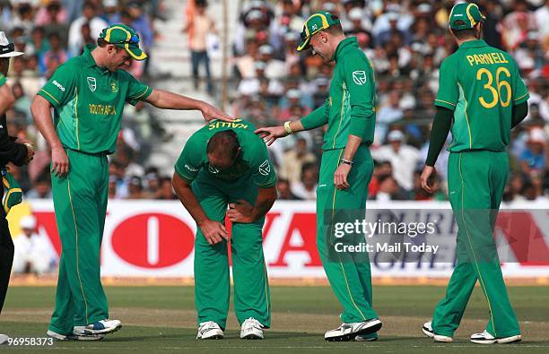 South Africa's cricket captain Jacques Kallis reacts in pain after an injury during the one day international cricket match between India and South...