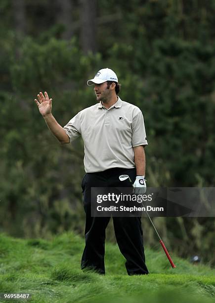 Dallas Cowboys quarterback Tony Romo waves after hitting his tee shot on the 12th hole during the second round of the AT&T Pebble Beach National...