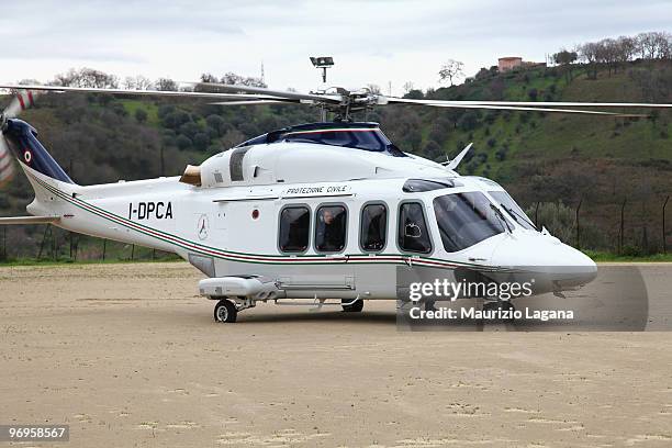 Head of civil protection Guido Bertolaso arrives by helicopter to visit the town of Maierato on February 22 near Reggio Calabria, Italy. The southern...