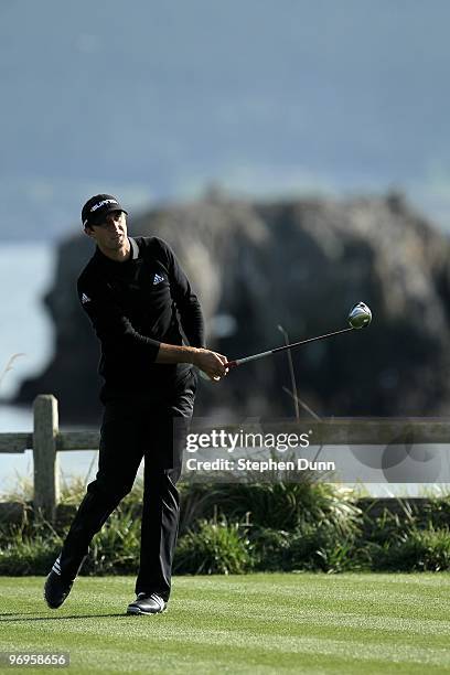 Dustin Johnson hits his tee shot on the 18th hole during the first round of the AT&T Pebble Beach National Pro-Am at Pebble Beach Golf Links on...