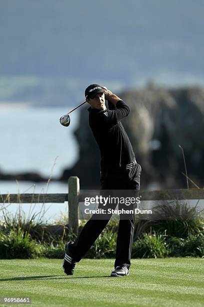 Dustin Johnson hits his tee shot on the 18th hole during the first round of the AT&T Pebble Beach National Pro-Am at Pebble Beach Golf Links on...
