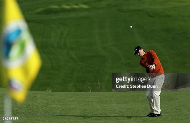 Bob Estes pitches to the sixth green during the first round of the AT&T Pebble Beach National Pro-Am at Pebble Beach Golf Links on February 11, 2010...