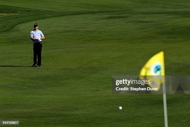 Padraig Harrington of Ireland watches his shot to the 12th green during the third round of the AT&T Pebble Beach National Pro-Am at Monterey...