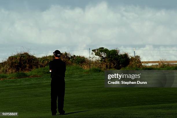 Adam Scott of Australia watches the high surf as he waits on the tenth fairway during the third round of the AT&T Pebble Beach National Pro-Am at...