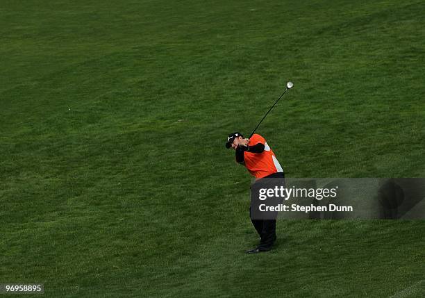 Holmes hits his second shot on the sixth hole during the first round of the AT&T Pebble Beach National Pro-Am at Pebble Beach Golf Links on February...