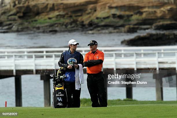 Holmes waits on the fairway on the fourth hole during the first round of the AT&T Pebble Beach National Pro-Am at Pebble Beach Golf Links on February...
