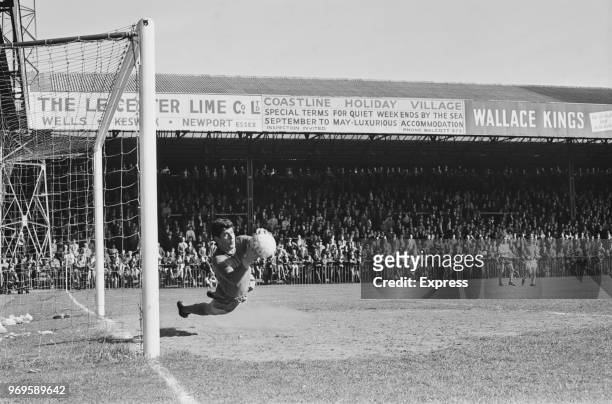 English goalkeeper Kevin Keelan of Norwich City FC making a save during a match against Cardiff City FC, Norwich, UK, 29th April 1967.