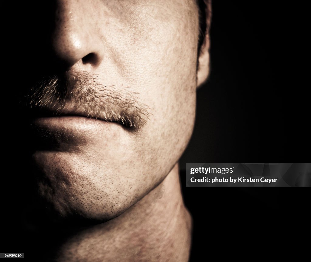 Close up of man's face with moustache