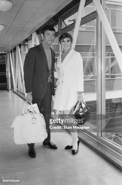 British-American hairstylist, businessman, and philanthropist Vidal Sassoon with his wife, Canadian actress and author Beverly Adams, at Heathrow...