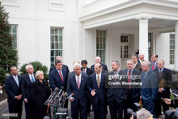 Charles "Charlie" Crist, governor of Florida, center, speaks to the media outside the White House with other governors after a meeting with U.S....