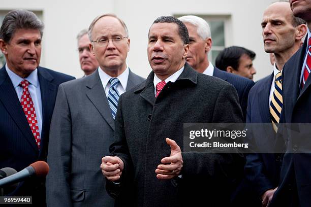 Joe Manchin, governor of West Virginia, left to right, and Jim Douglas, governor of Vermont, listen to David Paterson, governor of New York, speak to...