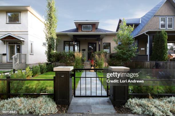 little house with green lawn - calgary ストックフォトと画像