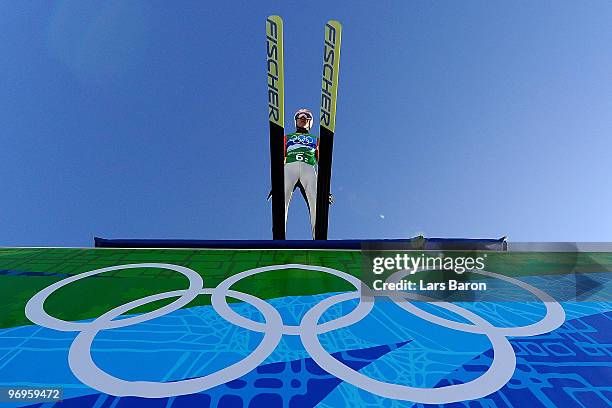 Taku Takeuchi of Japan competes in the men's ski jumping team event on day 11 of the 2010 Vancouver Winter Olympics at Whistler Olympic Park Ski...