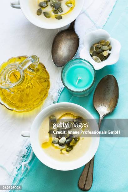 patty pan squash soup with olive oil and pumpkin seeds - pattypan squash stock pictures, royalty-free photos & images