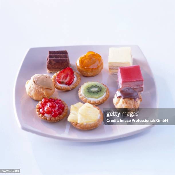 assorted sweet petit-fours - aspic stock pictures, royalty-free photos & images