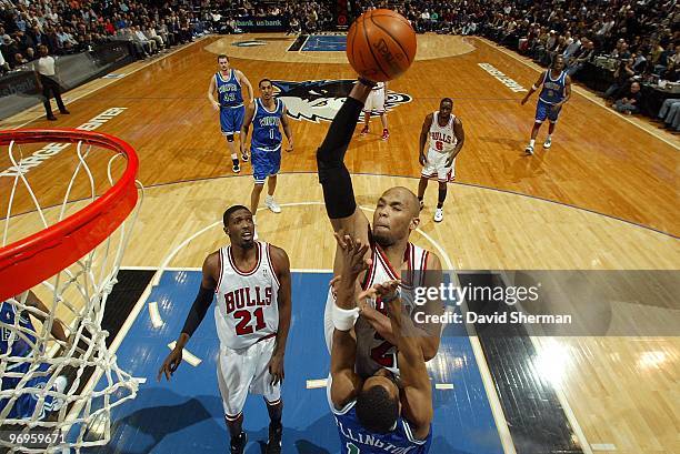 Taj Gibson of the Chicago Bulls goes for the dunk over Wayne Ellington of the Minnesota Timberwolves during the game on February 19, 2010 at the...