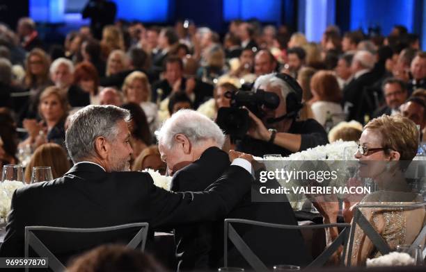 Actor George Clooney embraces his father Nick Clooney next to his mother Nina Bruce Warren during the 46th American Film Institute Life Achievement...