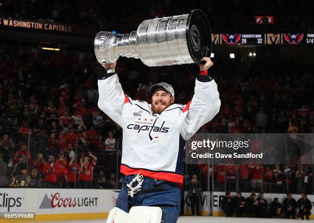 Philipp Grubauer of the Washington Capitals hoists the Stanley Cup after Game Five of the 2018 NHL Stanley Cup Final between the Washington Capitals...