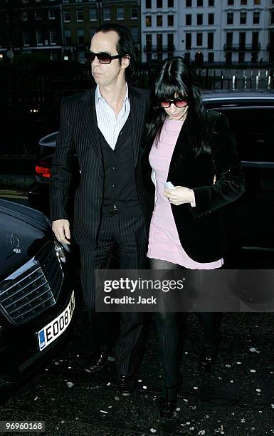 Nick Cave and wife Susie Bick arriving at the Pam Hogg fashion show on February 22, 2010 in London, England.