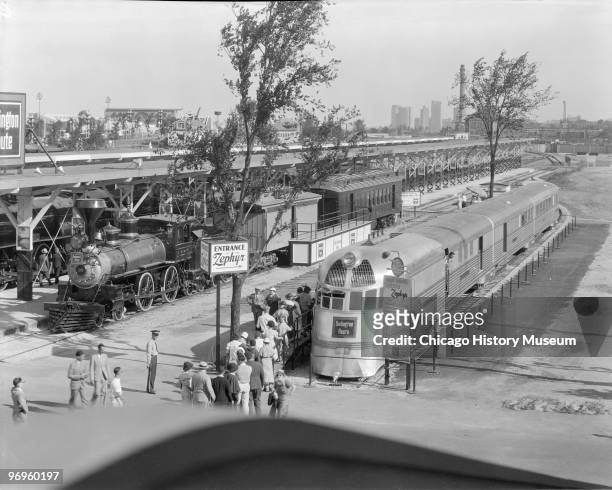 View of people as they line up to view the Burlington Zephyr at the Century of Progress International Exposition Chicago, Illinois, 1934. The...