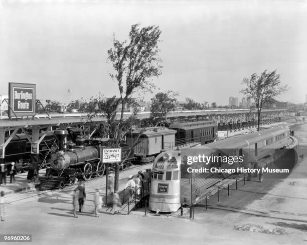 View of people as they line up to view the Burlington Zephyr at the Century of Progress International Exposition Chicago, Illinois, 1934. The...