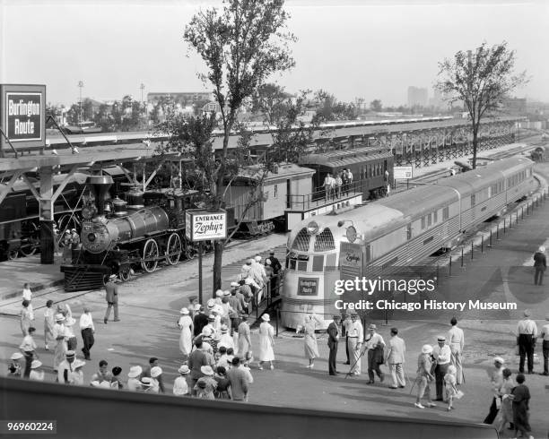 View of people as they line up to view the Burlington Zephyr at the Century of Progress International Exposition Chicago, Illinois, 1934. The...