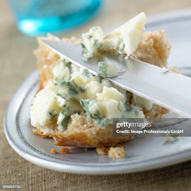 cheese spread on a piece of bread - cheese spread stock pictures, royalty-free photos & images