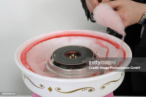 preparing cotton candy for a buffet - cotton candy stock pictures, royalty-free photos & images
