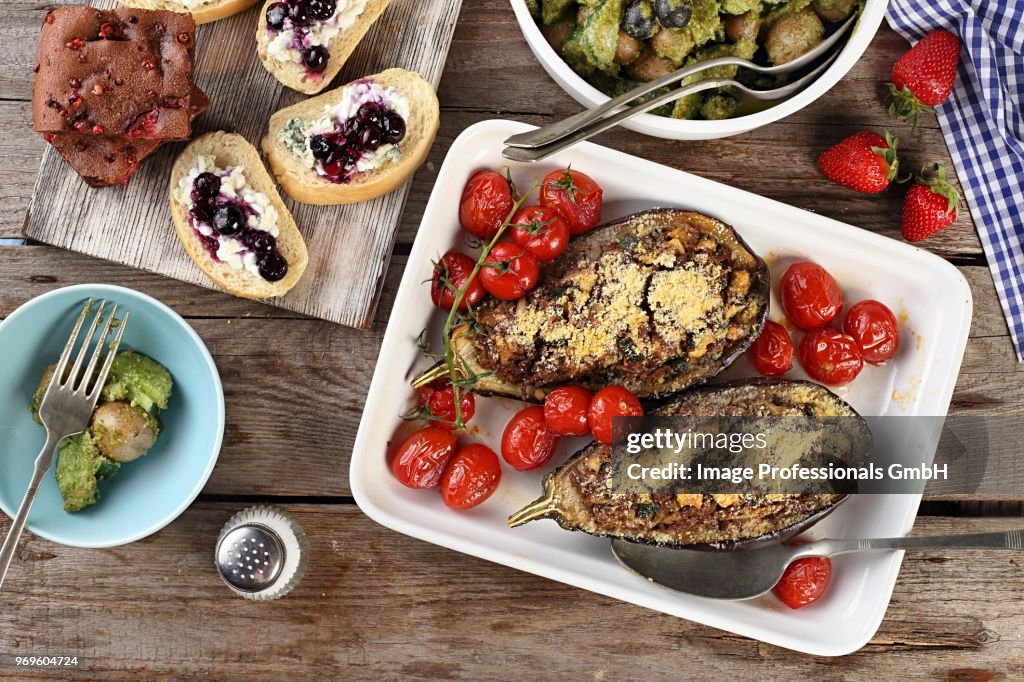 Stuffed aubergines, potato salad, baguette canaps and chocolate cake