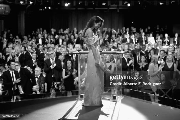 Amal Clooney speaks onstage during the American Film Institute's 46th Life Achievement Award Gala Tribute to George Clooney at Dolby Theatre on June...