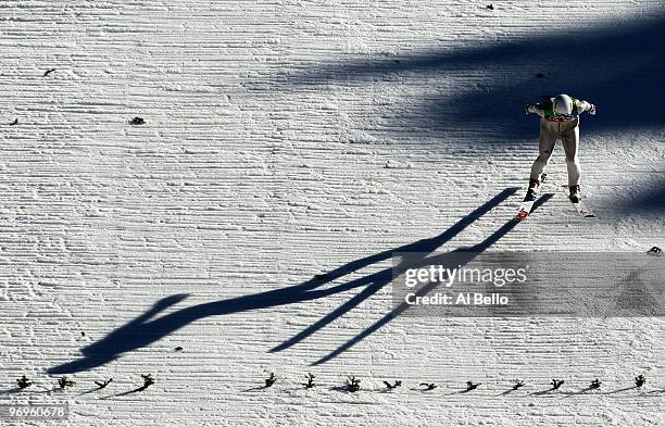 Martin Schmitt of Germany competes in his final jump in the men's ski jumping team event on day 11 of the 2010 Vancouver Winter Olympics at Whistler...