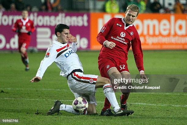 Ralph Gunesch of St. Pauli tackles Adam Nemec of Kaiserslautern during the Second Bundesliga match between 1.FC Kaiserslautern and FC St. Pauli at...