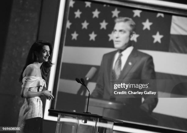 Amal Clooney speaks onstage during the American Film Institute's 46th Life Achievement Award Gala Tribute to George Clooney at Dolby Theatre on June...