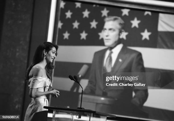 Amal Clooney speaks onstage during the American Film Institute's 46th Life Achievement Award Gala Tribute to George Clooney at Dolby Theatre on June...