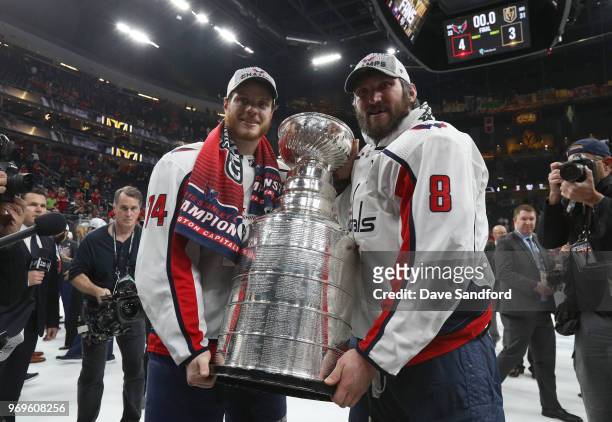 Captain Alex Ovechkin and John Carlson of the Washington Capitals pose for a photo with the Stanley Cup after Game Five of the 2018 NHL Stanley Cup...
