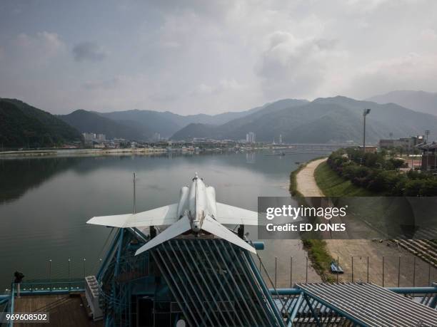 Photo taken on May 30, 2018 shows a general view of a decomissioned fighter jet in Hwacheon. - Declaring a formal end to the war will be one of the...