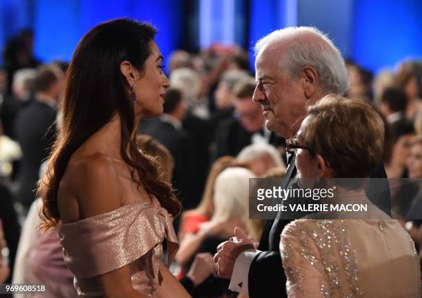 British-Lebanese barrister Amal Clooney speaks with Nick Clooney and Nina Bruce Warren during the 46th American Film Institute Life Achievement Award...