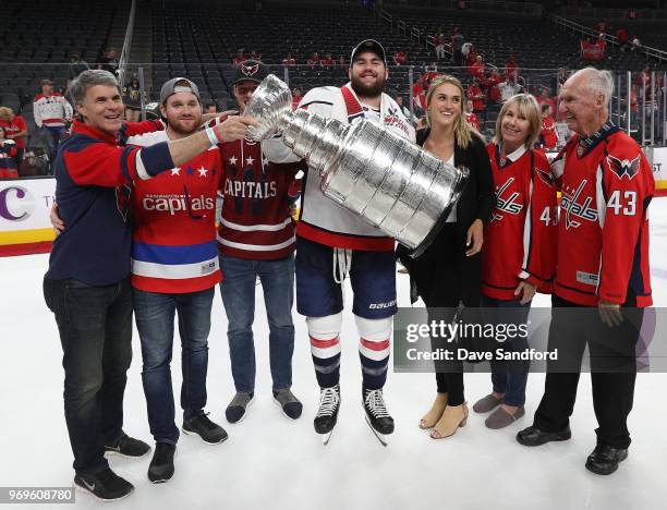 Tom Wilson of the Washington Capitals holds the Stanley Cup after Game Five of the 2018 NHL Stanley Cup Final between the Washington Capitals and the...